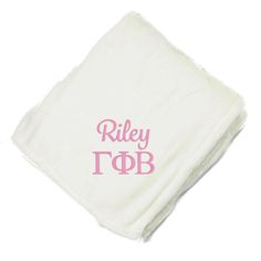 a white towel with the words riley tapb printed on it and pink letters across the bottom