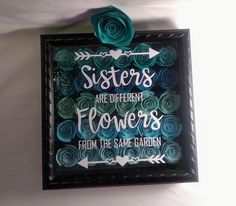 a sign that says sisters are different flowers from the same garden