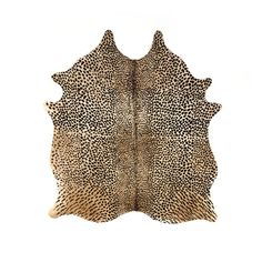 a brown and black animal print area rug on a white background with the top part of an animal's skin visible