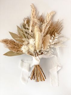 a bunch of dried flowers sitting on top of a table