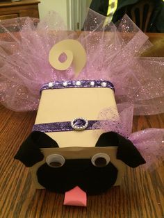 a cake shaped like a dog wearing a tutu