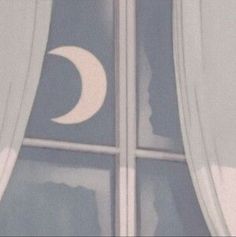 the moon and crescent symbol are seen through the window