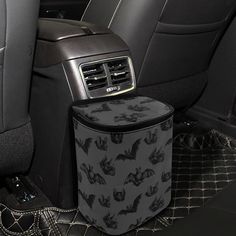 the interior of a car with bats on it and an air freshener dispenser