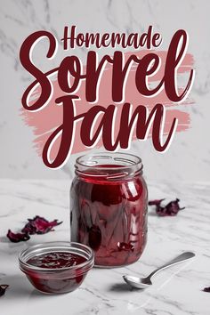 A large mason jar filled with vibrant red homemade sorrel jam placed on a white marble surface. A smaller bowl filled with the same jam sits beside it, along with a silver spoon. Dried sorrel petals are scattered decoratively in the background. Text overlay reads “Homemade Sorrel Jam” in bold, elegant script. Jam