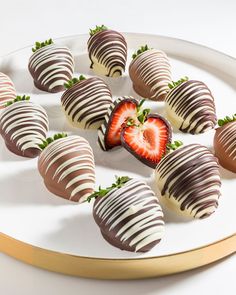 chocolate covered strawberries arranged on a white plate