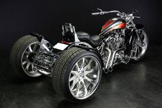 a motorcycle is shown with chrome rims and wheels