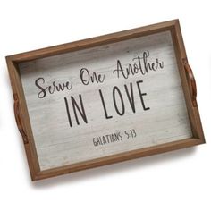 two wooden signs with the words serve one another in love and galatians 3 13