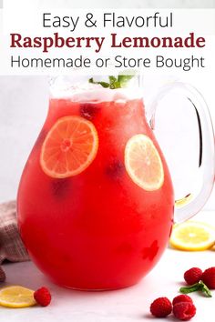 a pitcher filled with raspberry lemonade and garnish