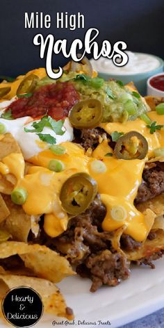 a white plate topped with nachos covered in cheese