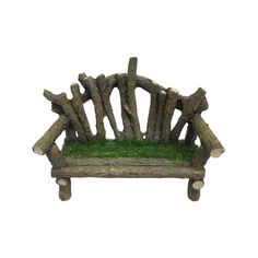 a miniature bench made out of logs and green grass on the seat is sitting in front of a white background