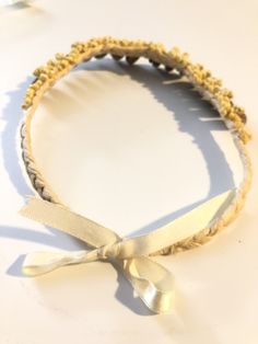 "Shell Choker. Strung from dried, braided palm leaves are olive shells embellished by tiny delicate shells. Very regal jewel from the sea. 16\". Ribbon closure." Shell Choker, Palm Leaves, Live Lokai Bracelet, The Sea, Choker, Shells, Beaded Necklace, Braids, Ribbon