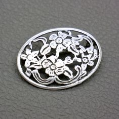 Introducing a lovely vintage 835 silver brooch, perfect for adding a touch of elegance and charm to your outfits. This oval openwork silver brooch features a delicate flower ornament and is crafted in the Victorian style. It's a perfect accent piece for any occasion, from casual to formal.  The brooch will be shipped in a gift box. Dimensions: 1 2/5" long by 1" wide (3.5 cm x 2.6 cm) Weight: 4.6 grams Rollover clasp closure Very good vintage condition, with lovely patina. The brooch is marked fo Silver Oval Brooches For Wedding, Silver Oval Wedding Brooches, Victorian Silver Oval Brooch, Silver Filigree Oval Brooches, Silver Oval Victorian Brooch, Silver Oval Filigree Brooches, Classic Oval Silver Brooches, Silver Oval Brooches For Anniversary, Silver Oval Brooch For Gift