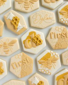 cookies decorated with honeycombs and bees are arranged in the shape of hexagons