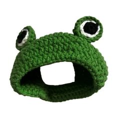 a crocheted green frog hat with eyes