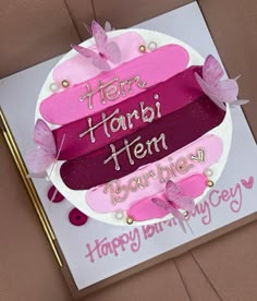 a birthday card with pink and purple butterflies on it that says, happy birthday harbi item