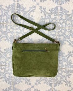 Boho bag in GREEN SUEDE. Genuine leather CROSSBODY bag in GREEN with zippers and adjustable strap. Natural suede leather in GREEN. Cross over or shoulder bag. The color of the bag corresponds to the 2 first pictures, it is not as light as on the 3rd picture. The inside of the bag is fully lined in a strong nylon-cotton mix fabric . It has a main zipper on its upper part and one extra zipper closed pocket at each side of the bag aswell. Adjustable suede straps. Width upper part: 30 cm - 12 inch H Green Leather Handled Crossbody Hobo Bag, Green Leather Handle Crossbody Hobo Bag, Green Soft Leather Crossbody Satchel, Green Suede Bags For Everyday Use, Green Suede Shoulder Bag For Everyday Use, Natural Leather Bag, Bag With Tassel, Guitar Bag, Slouch Bags