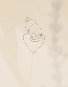 a drawing of a person holding a baby in their arms with the background blurry