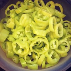 green peppers are in a bowl on the table