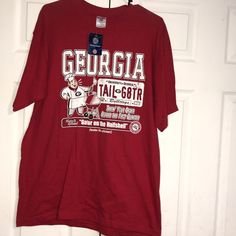 Nwt Men’s (Or Unisex) Red University Of Georgia Bulldogs Cotton Tee. Crew Neck. Distressed-Look Graphics Are Painted On (Like On A Jersey). Brand New But Pics 5&6 Show Both Shoulders Are Faded. Not Noticeable Once The Shirt Is On. Sz L. A Licensed Collegiate Product. Red Collegiate Cotton Top, Red Cotton Shirt For Game Day, Red Casual Shirt For Game Day, Casual Red Shirt For Game Day, Red Graphic Print Shirt For College, Red Cotton Fan Apparel Shirt, Red Cotton College Shirt, Red Short Sleeve Shirt For College, Pre-shrunk Red Shirt For College