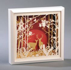 a card with an image of a deer in the woods