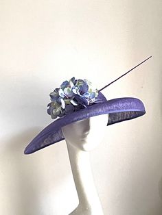 Violet disc hat Violet hat made of sinamay base attached to the rubber band. On the side is sitting matching hydrangea and a feather.  The hat is very elegant. The hat will be an amazing accessory to compliment your outfit at the Royal Ascot races, Kentucky Derby races, Wedding or a Garden party. The hat will fit an average head size. Enjoy your special day with this beautiful headpiece! Purple Brimmed Summer Fascinator, Purple Mini Hats For Summer Church Events, Fitted Purple Hat With Short Brim, Purple Mini Hats For Summer Church, Purple Mini Hats For Church In Summer, Purple Short Brim Top Hat For Summer, Summer Wide Brim Purple Costume Hat, Purple Wide Brim Summer Costume Hat, Summer Purple Wide Brim Costume Hat