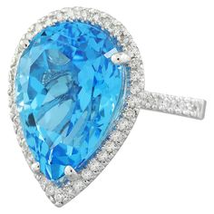 Stamped: 14K Total Ring Weight: 6.4 Grams Topaz Weight 16.00 Carat (18.00x13.00 Millimeters)Diamond Weight: 0.65 carat (F-G Color, VS2-SI1 Clarity )Face Measures: 22.75x16.55 Millimeter SKU: [600645] Fine Jewelry Pear-shaped Topaz Ring, Pear-shaped Topaz Ring For Formal Occasions, Formal Teardrop Topaz Rings, Formal Pear-shaped Topaz Ring, Formal Pear-shaped Topaz Ring Fine Jewelry, Formal Teardrop Blue Topaz Ring, Fine Jewelry Pear-shaped Topaz Ring With Brilliant Cut, Pear-shaped Brilliant Cut Topaz Ring In Fine Jewelry Style, Classic Pear-shaped Topaz Ring For Formal Occasions