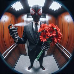 a man in a suit and tie holding flowers with a spider - man mask on