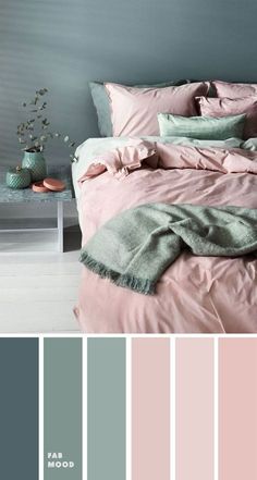 a bedroom with pink and grey colors in the walls, bed linens and pillows