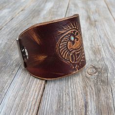 "Made from top quality Italian vegetable tanned leather. Hand painted, embossed. Cuff is 2,1 inches (5,5 cm) wideAdjustable Size approx between 15 and 18 cm Please measure carefully your wrist and select the most preferable size! If you need a diferent size, please let me know after purchase in \"note for seller\". Please visit to my another shop: https://www.etsy.com/shop/JeansBelt?ref=hdr_shop_menu FEDEX to USA and Australia! If you need a faster shipping please use this service. The delivery Perfume Locket, Aromatherapy Jewelry, Cuff Jewelry, Cuff Watch, Diffuser Bracelets, Veg Tan Leather, Leather Cuffs Bracelet, Leather Cuffs, Vegetable Tanned Leather