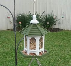 a bird feeder in the shape of a gazebo