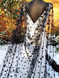 a black and white dress with stars on it