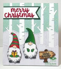 a christmas card with two gnomes and a sign that says merry christmas on it