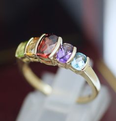 Absolutely Stunning Hand Made Ring. Made in Solid 9K Yellow Gold Set With Multicolour gemstone Metal: 9k Solid Yellow Gold (Marked, and Professionally Tested,Cleaned and Polished ) Stamped;375J.P24 Total Weight;2.37Gram Condition:Pre-Owned The ring in Excellent Condition (any dark marks on the gold in the photos are only reflections) Ring Come with New Luxury Box (different as in the photo). Heirloom Multi-stone Yellow Gold Gemstones, Classic Multi-stone Yellow Gold Gemstones, Classic Yellow Gold Multi-stone Gemstones, Hallmarked Multicolor 14k Gold Rings, Multicolor 14k Gold Hallmarked Rings, Yellow Gold Multi-stone Jewelry For Anniversary, Multicolor Multi-stone Birthstone Ring For Anniversary, Anniversary Multi-stone Yellow Gold Jewelry, Multicolor 14k Gold Rings