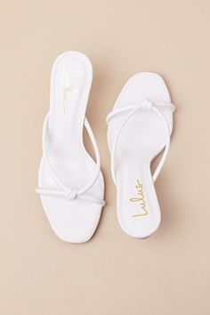 The Lulus Victoire White Knotted Strappy High Heel Slide Sandals are here to complete all your simply stunning date night looks! These strut-worthy sandals have a faux leather construction that shapes an open-toe upper and an almond-shaped footbed. Crisscrossing straps boast a knotted detail atop the slide-on silhouette that sits atop a flirty stiletto heel. 2. 75" wrapped stiletto heel. Cushioned insole. Rubber sole has nonskid markings. Man made materials. Imported. Lulus | Victoire White Knot Chic Sandals With Single Toe Strap For Date Night, Summer Sandals With Wrapped Heel For Date Night, Summer Date Night Sandals With Open Heel, Spring Date Night Sandals With Single Toe Strap, Open Toe Sandals With Padded Heel For Date Night, Sandals With Padded Open Toe For Date Night, Summer Sandals With Padded Heel For Date Night, Summer Date Night Sandals With Padded Heel, Chic Synthetic Sandals For Date Night