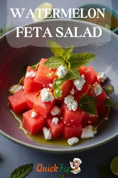 watermelon feta salad in a bowl with mint leaves