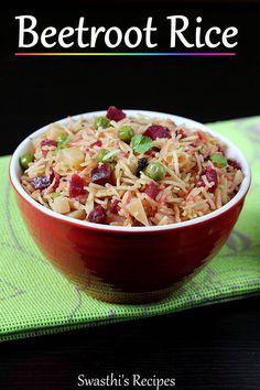 a red bowl filled with food on top of a green place mat