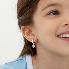 These dangle cubic zirconia earrings for little girls are adorable for the little heart lover in your life. These adorable girl's earrings are crafted entirely in 925 sterling silver, a naturally HYPOALLERGENIC fine metal, making it safe for sensitive ears. They feature a 12mm safety hoop design with a CZ-covered heart dangle charm. These toddler & young girl earrings make a perfect gift for any occasion as well as for everyday fashion. A complimentary gift box is included for easy giving! Girl Earrings, Heart Hoop Earrings, Hoop Design, Puffed Heart, Cubic Zirconia Earrings, Zirconia Earrings, Girly Jewelry, Dangle Charms, Girls Earrings