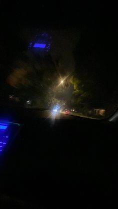 the dashboard of a car at night time