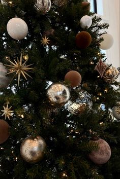 a christmas tree with ornaments hanging from it