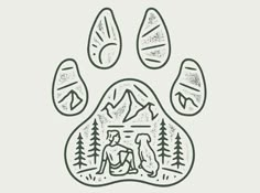 an animal paw print with mountains and trees in the background