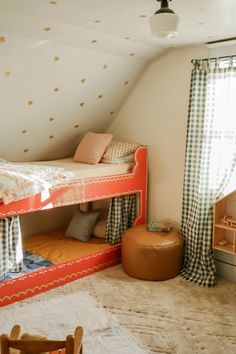 a bedroom with bunk beds and curtains in it