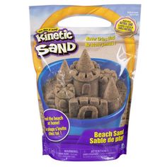 a bag of sand that is in the shape of a castle on top of a blue bowl