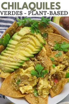 a plate with nachos, avocado and cilantro on it