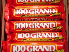 five packs of 100 grand chocolate bars stacked on top of each other