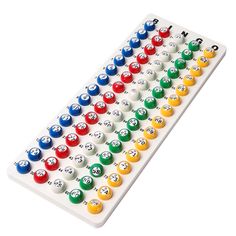 a large white board with many colored balls on it's sides and numbers in the middle