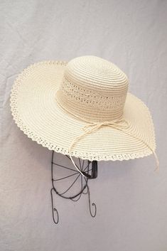 Vintage inspired wide brimmed straw hat. Hat features round crown, soft straw, and a matching ribbon trim along with lace trim. Inner crown features ties to adjust for head size. Product Details measurements: one size Brim- 4.72in Circumference- 23in material: straw imported Spring Crochet Hat With Adjustable Trim, Adjustable Lined Sun Hat For Spring, Spring Adjustable Lined Sun Hat, Summer Hats With Crochet Trim, Spring Sun Hat With Crochet Trim And Curved Brim, Vacation Hat With Crochet Trim And Curved Brim, Vacation Hats With Crochet Trim And Curved Brim, Elegant Adjustable Crochet Hat For Spring, Beige Adjustable Hat With Ribbon