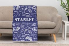 a couch with a blanket on it that says stanley