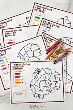 five thanksgiving coloring pages with colored pencils on top of them and the words thanksgiving written in