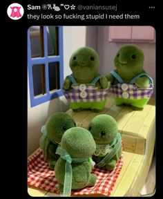 three stuffed animals sitting on top of a table