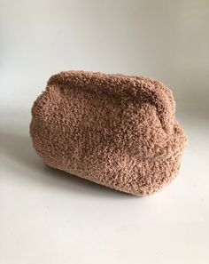 a brown bag sitting on top of a white table